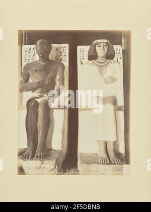 Musée de Guizeh - Le fils royal Ra-Hotep et la dame du roi Nefer-tete. Seated statues of two figures, a male and a female, both of whom depicted as members of the ancient Egyptian aristocracy. The figures' seats also bear a number of painted hieroglyphs.. (Recto, print) lower center, inscribed in the negative: '1140   MusÈe de Guizeh   Le fils royal Ra-Hotep et la dame du roi Nefer-T partially cropped'; Stock Photo