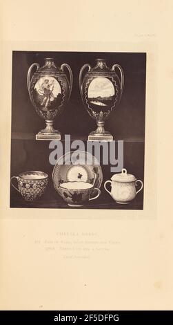Two vases, three cups, and a saucer. A pair of vases on a riser behind three cups and a saucer. The vases are both painted with stripes, and have two looped handles. Each vase has a plaque painted on the body, the left featuring a figure, the right a landscape. The cups and saucers are painted with flowers, striped and dotted patterns, and medallions.. (Recto, mount) upper right, printed in black ink: "PLATE CXCIV." Lower center, printed in black ink: "CHELSEA DERBY. / 375. PAIR OF VASES, GOLD STRIPES AND VIEWS. / 376-8. THREE CUPS AND A SAUCER. / Lord Scarsdale. italicized" Stock Photo