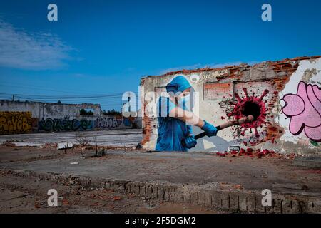 Vila Nova De Gaia, Portugal. 13th Nov, 2020. A graffiti by Mr. Dheo, a famous Portuguese street artist, painted in an abandoned factory in Arcozelo, Vila Nova de Gaia. It is called 'Anjos na terra' which means 'Angels on earth' paying tribute to all the nurses helping fight COVID-19. Portrayed here is Nurse Sofia who got COVID 19 in march 2020 but got back helping fight COVID 19 again. (Photo by Teresa Nunes/SOPA Images/Sipa USA) Credit: Sipa USA/Alamy Live News Stock Photo