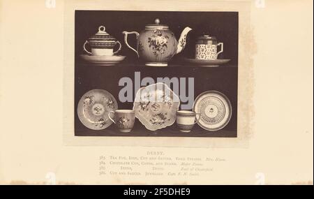 Tea pot, cups, and saucers. A tea pot on a shelf flanked by two cups and saucers. Below the shelf are two more cups and three additional saucers. The tea pot is painted with thin stripes and flowers. The cups and saucers are each decorated with painted flowers, stripes, and patterned bands. The two cups on the shelf each have a painted lid.. (Recto, mount) upper right, printed in black ink: "PLATE CXCVI." Lower center, printed in black ink: "DERBY. / 383. TEA POT, DISH, CUP AND SAUCER. GOLD STRIPES. Mrs. Nixon. italicized / 384. CHOCOLATE CUP, COVER, AND STAND. Major Evans. italicized / 385. D Stock Photo