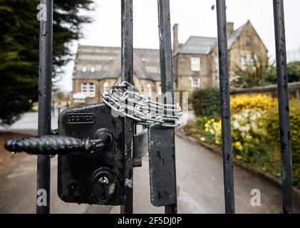 Chained gates at Batley Grammar School in Batley, West Yorkshire, where a teacher has been suspended for reportedly showing a caricature of the Prophet Mohammed to pupils during a religious studies lesson. Picture date: Friday March 26, 2021. Stock Photo