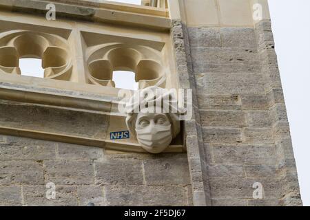CHRISTCHURCH, ENGLAND – MARCH 26 2021: New stone carving of a masked PPE NHS Worker commemorating or celebrating the Covid 19 Pandemic NHS work on Chr Stock Photo