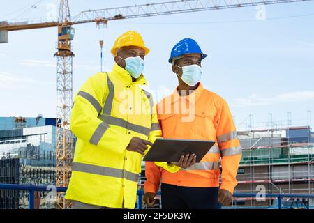 Construction Site Engineer And Building Inspection Pointing Stock Photo