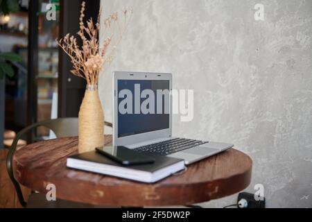 laptop phone note book lie on the table Stock Photo