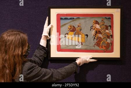 Bonhams, London, UK. 26 March 2021. Preparations for Bonhams spring sale of Islamic and Indian Art on 30 March includes A Jodhpur Nobleman on Horseback with a Group of Lancers, circa 1810-20, estimate: £3,000-5,000. Credit: Malcolm Park/Alamy Live News Stock Photo