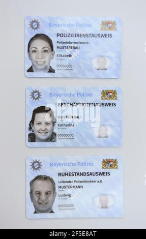 26 March 2021, Bavaria, Roding: Sample copies of the new Bavarian police service ID card, taken at a press event. After 35 years, the old green service cards will be replaced by a new, particularly forgery-proof card in credit card format. Photo: Tobias Hase/dpa Stock Photo