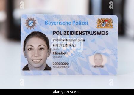 26 March 2021, Bavaria, Roding: A sample of the new Bavarian police ID card, taken at a press event. After 35 years, the old green service cards will be replaced by a new, particularly forgery-proof card in credit card format. Photo: Tobias Hase/dpa Stock Photo