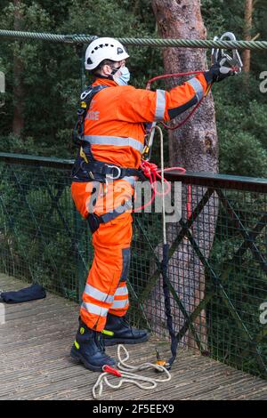 Dorset Fire Service carrying out training exercise on suspension bridge at Alum Chine, Bournemouth, Dorset UK in March during Covid-19 lockdown Stock Photo