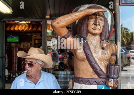 Senior man at Cigar Shop entrance in Calle Ocho, Little Havana, Miami, USA Stock Photo