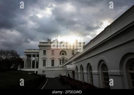 Washington, USA. 26th Mar, 2021. The sun rises behind the White House on Friday, March 26, 2021 in Washington, DC. (Photo by Oliver Contreras/SIPA USA) Credit: Sipa USA/Alamy Live News Stock Photo
