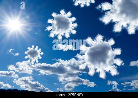 Coronavirus shaped awful clouds on the blue sky and white clouds Stock Photo