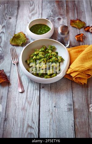 Italian gnocchi with pesto Stock Photo