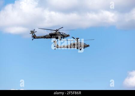 ΑΗ-64 Apache helicopters flying in formation in the sky of Athens, Greece, during the military parade for the 200 years of the Greek Independence War Stock Photo