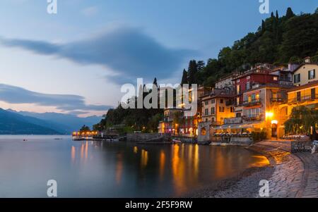Varenna village in the evening light twilight on the eastern shore of Lake Como Italy in April Stock Photo
