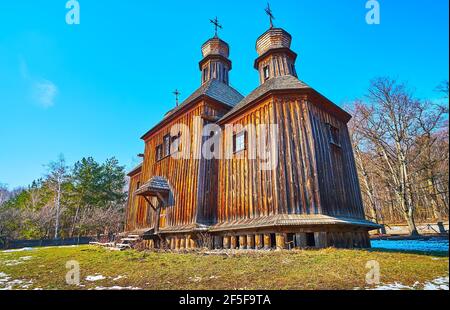 The medieval timber St Michael Church is and example of historic Dnieper Ukrainian architecture, located in Pyrohiv Skansen, Kyiv, Ukraine Stock Photo