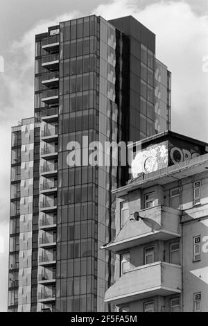 The new Skyline Apartments, Woodberry Down, North London UK, behind a partly demolished council block during redevelopment in March 2021