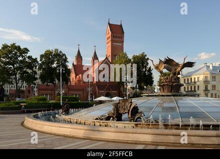 Minsk, Belarus - September 12, 2019. Church of Saints Simon and Helena . Red church on Independence Square in Minsk. Stock Photo