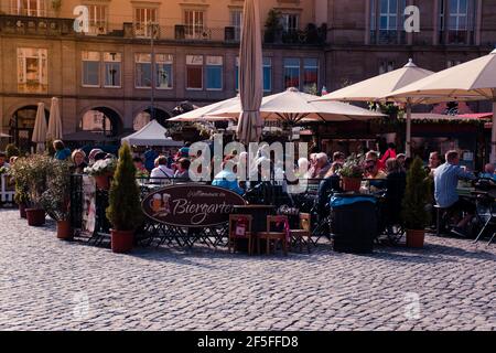 17 May 2019 Dresden, Germany - Biergarten at Altmarkt. People in a beer garden pub. Stock Photo