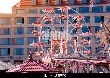 17 May 2019 Dresden, Germany - Ferris wheel at Altmarkt in morning. Trade center on background. Stock Photo