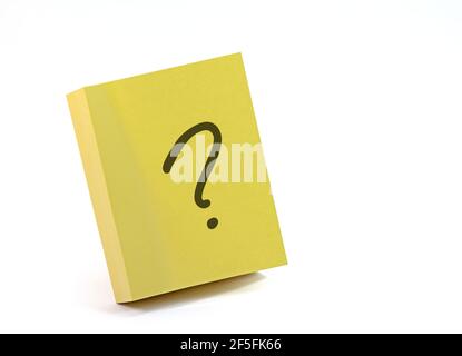 Sticky note pad with question mark against a white background Stock Photo