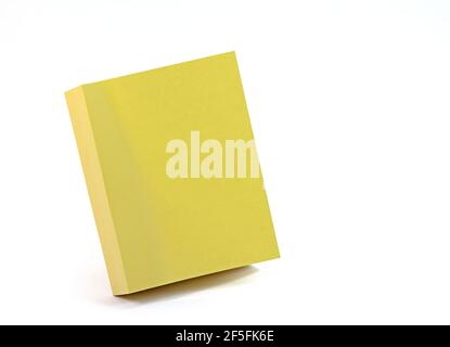 Sticky note pad with yellow pieces of paper against a white background Stock Photo