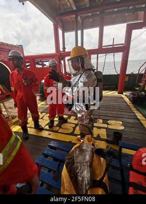 seafarer carried out monthly fire drill on deck, to refresh their training and test all emergency fire pump and fire hose Stock Photo