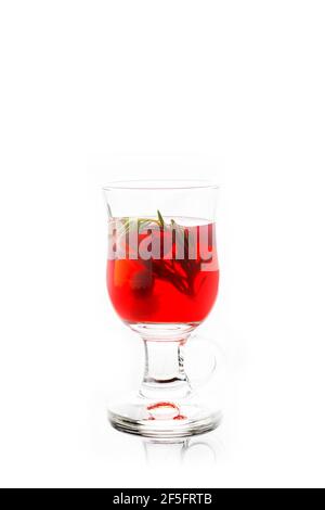 Hot raspberry beverage with rosemary. Selective focus. Shallow depth of field. Isolated on white background. Stock Photo
