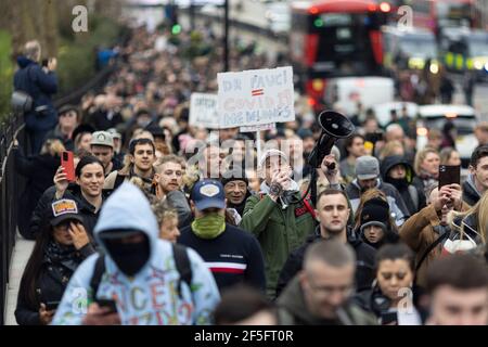 Anti-lockdown and anti Covid-19 vaccination protest, London, 20 March 2021. Protesters marching.