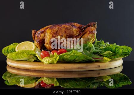 Roast Chicken on a bed of salad leaves Stock Photo