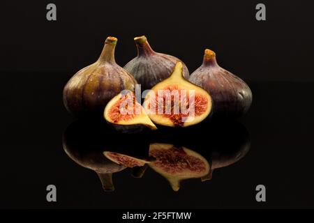 Fresh Figs on a shiny black surface Stock Photo