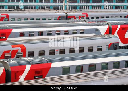 Moscow, Russia - March 26, 2021: Railway carriages in a row stand near the railway station Moskva-Passazhirskaya in the city of Moscow. High quality photo Stock Photo