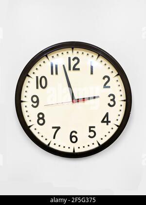 Vintage wall clock isolated on the white background Stock Photo
