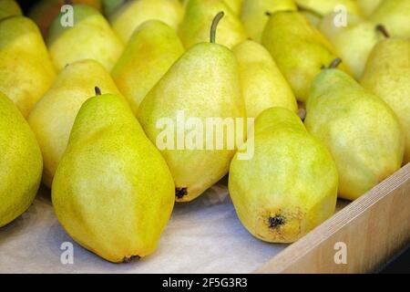 Fresh ripe pears lie on a white wooden table Stock Photo - Alamy