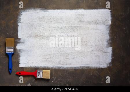 Painted background texture of abstract surface and paintbrush. White paint background canvas Stock Photo