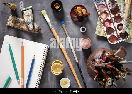 Paintbrush and tubes with painter tools at abstract table background texture. Art painter concept and paint brush Stock Photo