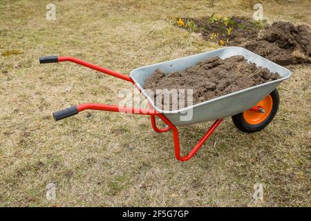 cart for carrying cargo in the garden, Tool for gardening and home farming Stock Photo