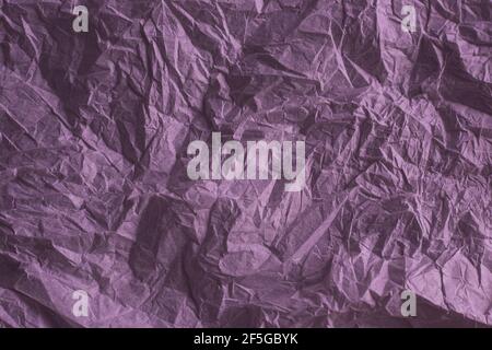 background from crumpled texture paper in burgundy color, template for text Stock Photo