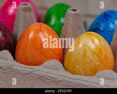 Colored chicken eggs in the package Stock Photo