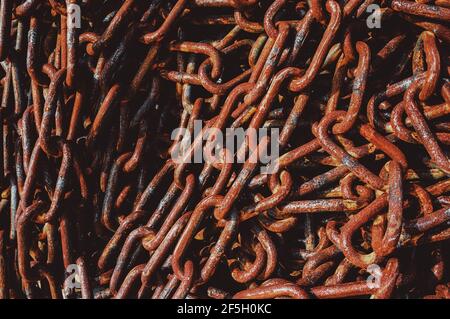 Abstract of Thick Rusty Chain Background Image with Vignette. Rusty chain texture . Stock Photo