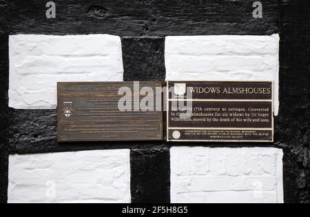 Tourist information plaques on the Widows Almshouses building at Welsh Row in Nantwich Stock Photo