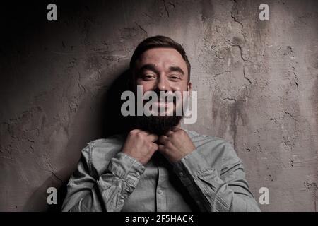 A handsome young man with a beard. The emotions of a man. Depression or hopelessness. Dramatic emotional portrait of a man. High quality photo Stock Photo