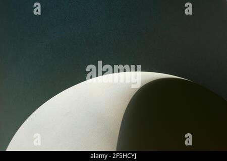 Macro image of dark grey paper with shadow effect and selective focus. Abstract geometric background. Copy space. Stock Photo