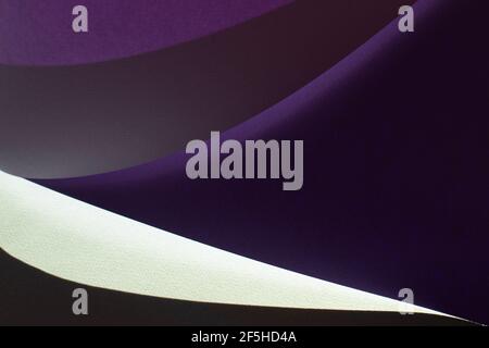 Macro image of purple paper with shadow effect and selective focus. Abstract geometric background. Copy space. Stock Photo