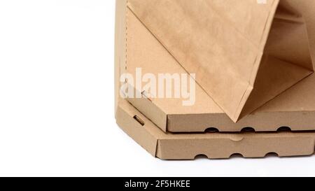 Paper bag and pizza delivery boxes on white table background, phone green screen, note. Mockup for design, copy spase. Stock Photo