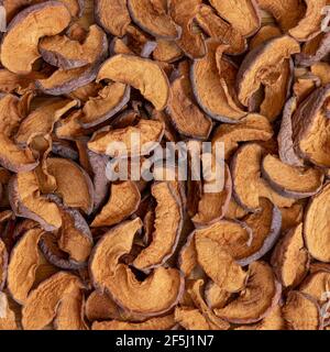 Dried fruit. Background of dried slices apples, group of dry slices of apple. Stock Photo