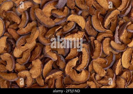 Dried fruit. Background of dried slices apples, group of dry slices of apple. Stock Photo