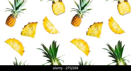 Seamless pattern of ripe pineapples and slices isolated on white background. Top view. Tropical fruit summer exotic concept. Stock Photo