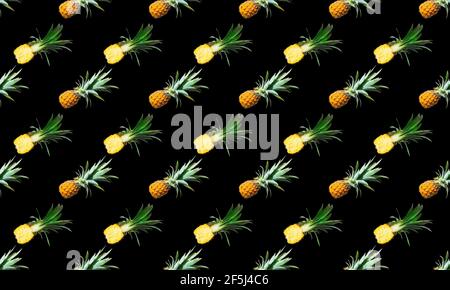 Seamless pattern of ripe pineapples isolated on black background Stock Photo