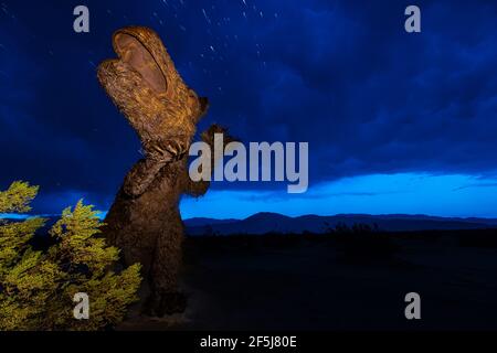 Borrego Springs, CA. March 23, 2021. A sculpture of a dinosaur by Mexican artist Ricardo Breceda captured during a stormy spring afternoon. Stock Photo