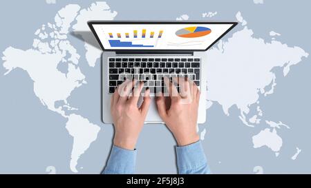 Global business concept with person and laptop on the background of the world map Stock Photo